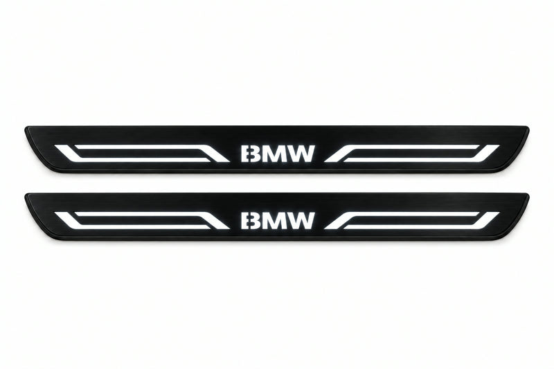 Catalogue illustration of two front black Matte PRO LED door sill plates with illuminated BMW LINE lettering for BMW X5 E70; dimensions are selected during manufacture.
