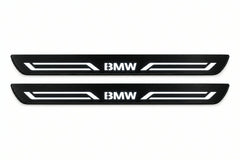 Catalogue illustration of two front black Matte PRO LED door sill plates with illuminated BMW LINE lettering for BMW X5 E70; dimensions are selected during manufacture.