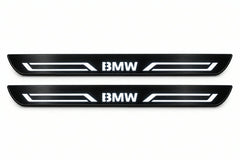 Catalogue illustration of two front black Matte PRO LED door sill plates with illuminated BMW LINE lettering for BMW X5 F15; dimensions are selected during manufacture.