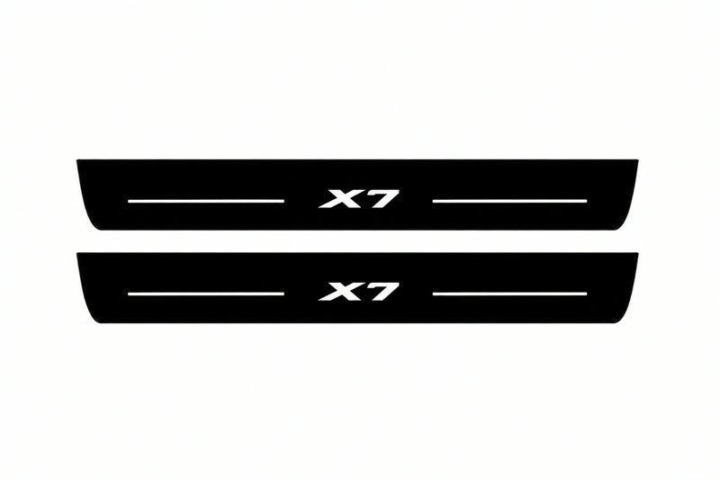 Catalogue illustration of two front black Matte PRO LED door sill plates with illuminated X7 lettering for BMW X7 G07; dimensions are selected during manufacture.