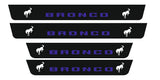 Catalog illustration of four black door sill plates with blue Bronco lettering and white bucking horse emblems.