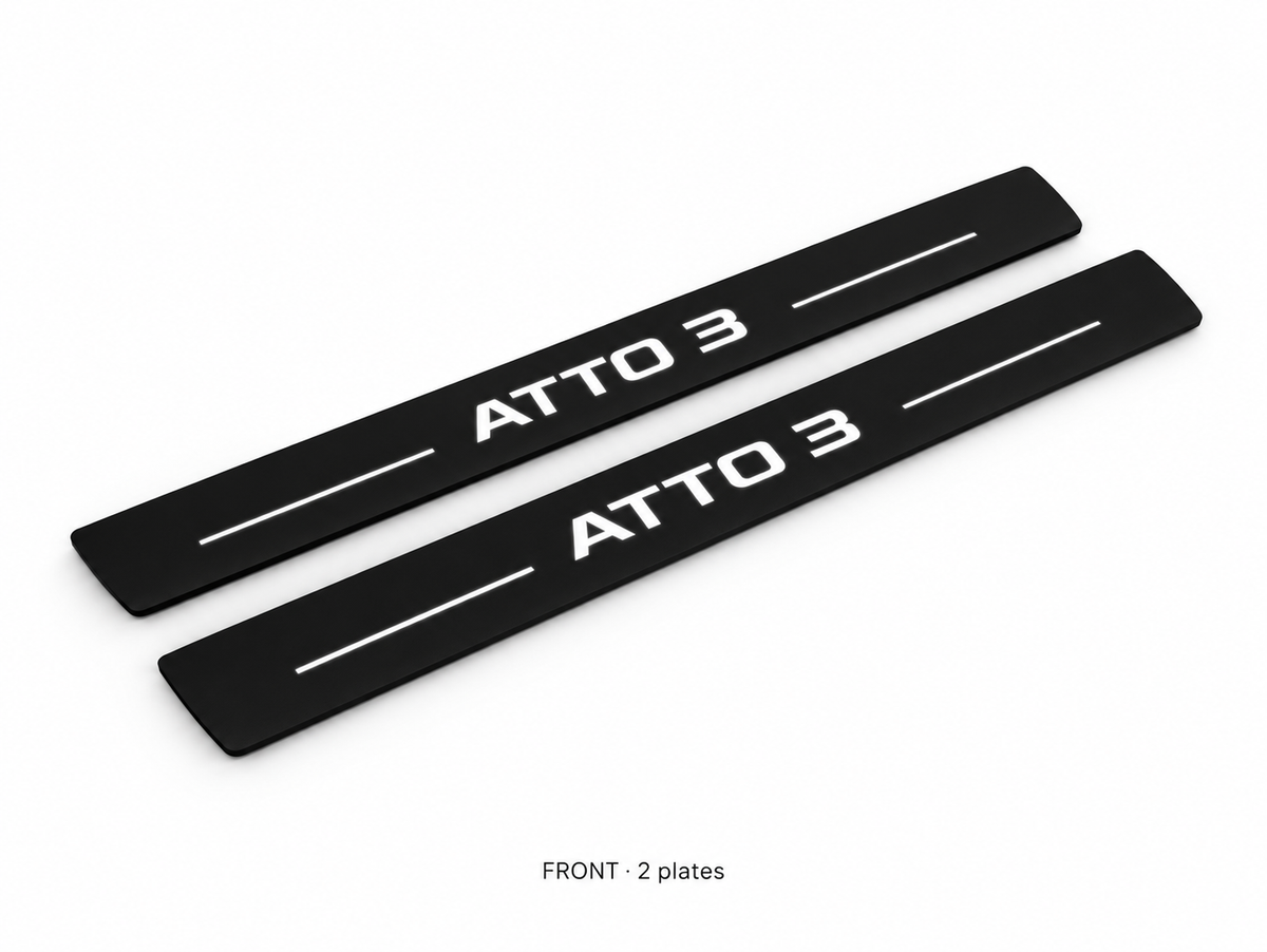 Matte PRO catalogue illustration: two flat black FRONT plates with illuminated ATTO 3 lettering and top lines on white; not exact vehicle dimensions
