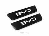 Matte PRO catalogue illustration of two black FRONT door sill plates with illuminated BYD lettering on a white background; vehicle dimensions not shown