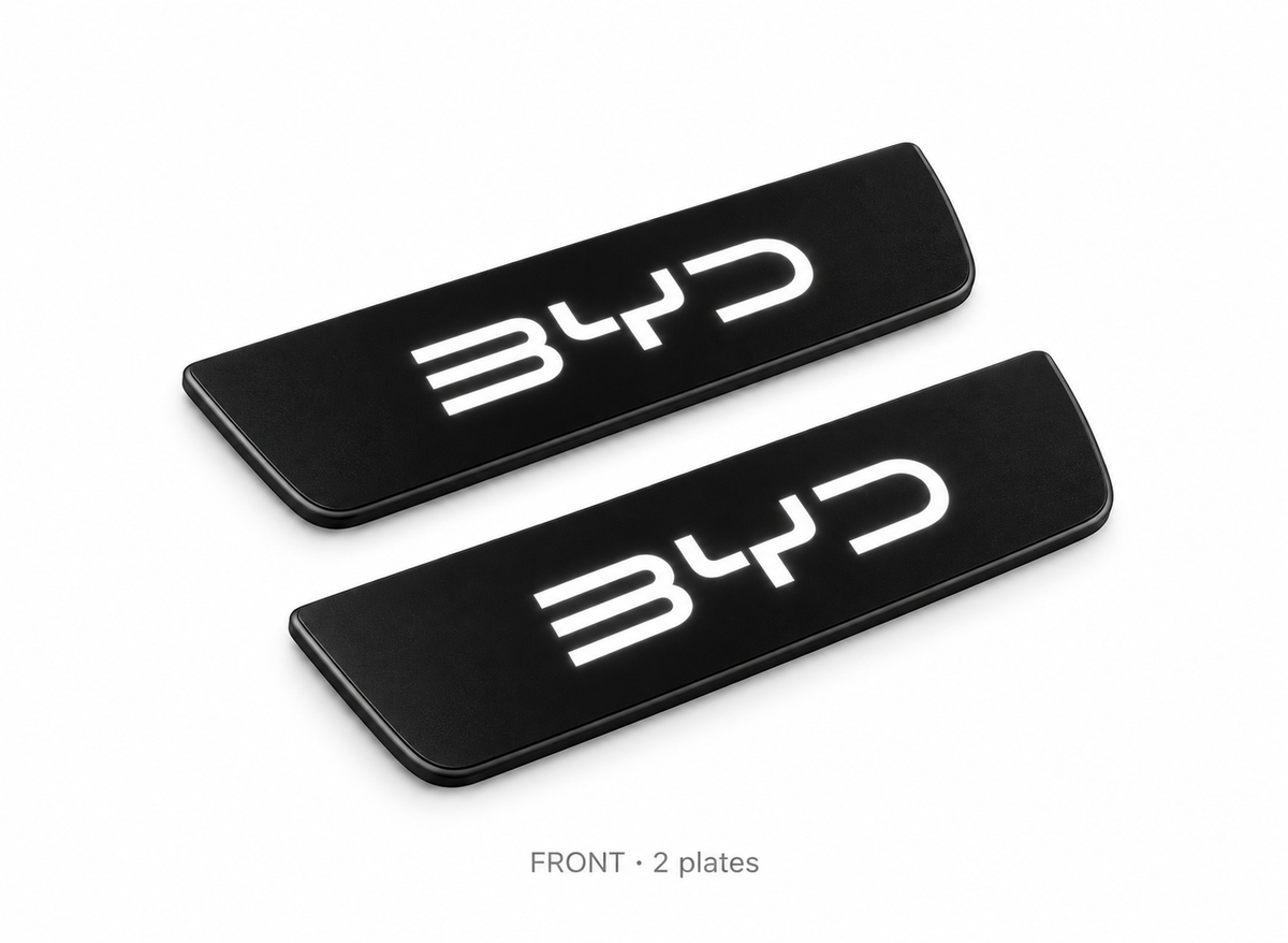 Matte PRO catalogue illustration of two black FRONT door sill plates with illuminated BYD lettering on a white background; vehicle dimensions not shown