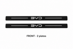 Matte PRO catalogue illustration: two flat black FRONT plates with illuminated BYD lettering and top lines on white; not exact vehicle dimensions