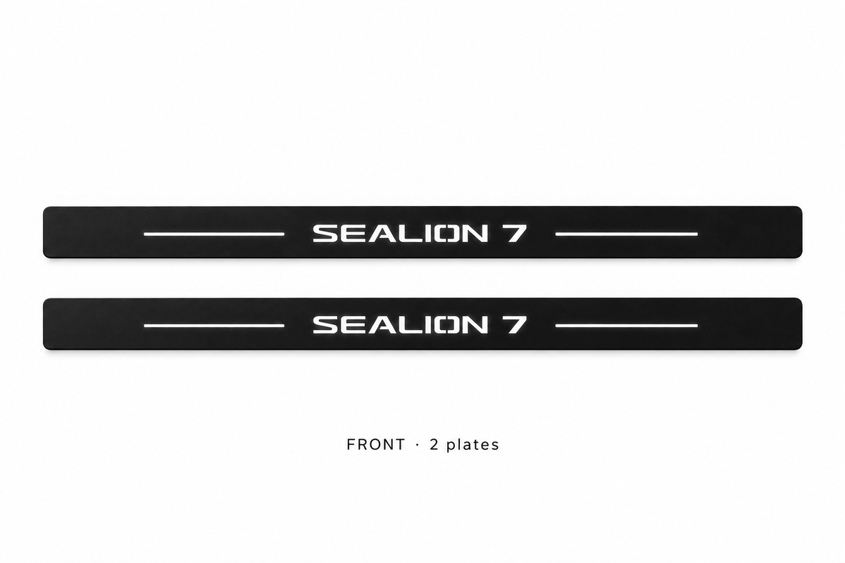 Matte PRO catalogue illustration: two flat black FRONT plates with illuminated SEALION 7 lettering and top lines on white; not exact vehicle dimensions