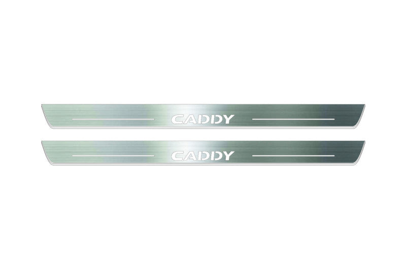 Two long silver-finished door sill plates with Caddy lettering on a light background, straight-on view.