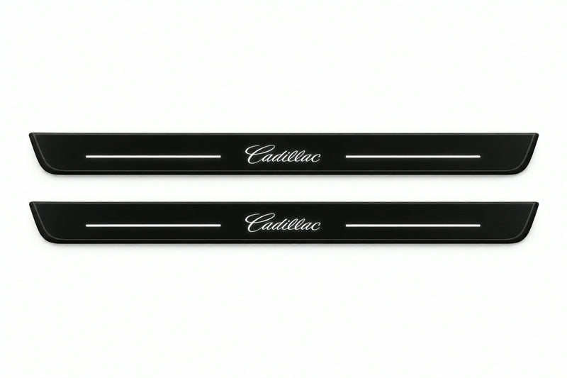 Catalogue illustration of two front black Matte PRO LED door sill plates with illuminated Cadillac lettering for Cadillac CTS II GM325; dimensions are selected during manufacture.