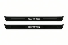 Catalogue illustration of two front black Matte PRO LED door sill plates with illuminated CTS lettering for Cadillac CTS II GM325; dimensions are selected during manufacture.