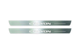 Two long silver-finished door sill plates with Canyon lettering on a light background, straight-on view.
