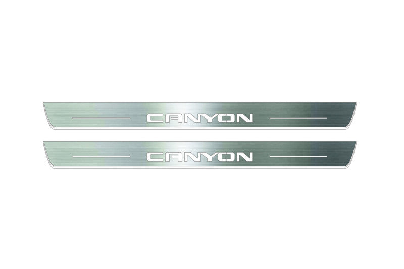 Two long silver-finished door sill plates with Canyon lettering on a light background, straight-on view.