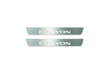 Two short silver-finished door sill plates with Canyon lettering on a light background, straight-on view.