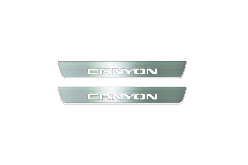 Two short silver-finished door sill plates with Canyon lettering on a light background, straight-on view.