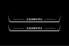Two long door sill plates with Cerato lettering and edges illuminated in white, straight-on view on a dark background.