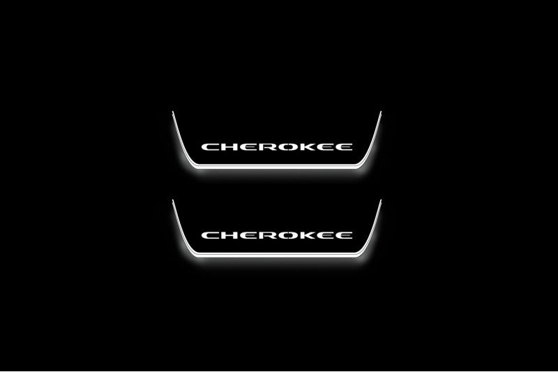 Two short door sill plates with Cherokee lettering and edges illuminated in white, straight-on view on a dark background.