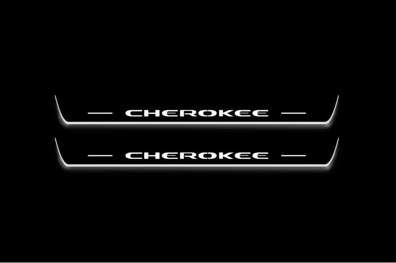 Two long door sill plates with Cherokee lettering and edges illuminated in white, straight-on view on a dark background.