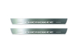 Two long silver-finished door sill plates with Cherokee lettering on a light background, straight-on view.