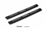 Matte PRO catalogue illustration: two flat black FRONT plates with illuminated TIGGO 8 lettering and top lines on white; not exact vehicle dimensions