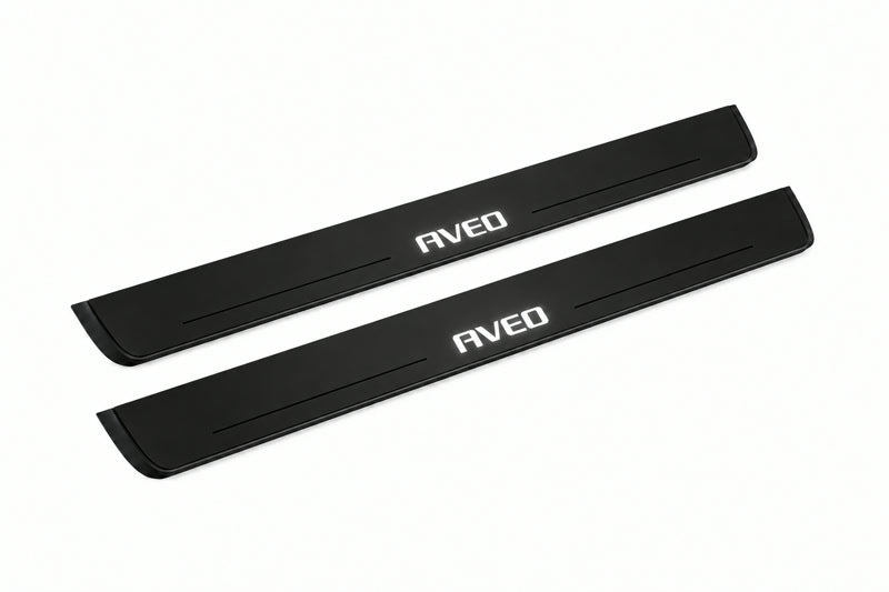 Catalogue illustration of two front black Matte PRO LED door sill plates with illuminated Aveo lettering for Chevrolet Aveo II T300; dimensions are selected during manufacture.