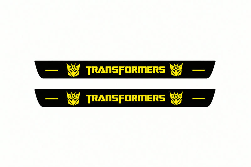 Catalogue illustration of two front black Matte PRO LED door sill plates with illuminated Transformers Decepticon lettering for Chevrolet Camaro E37; dimensions are selected during manufacture.
