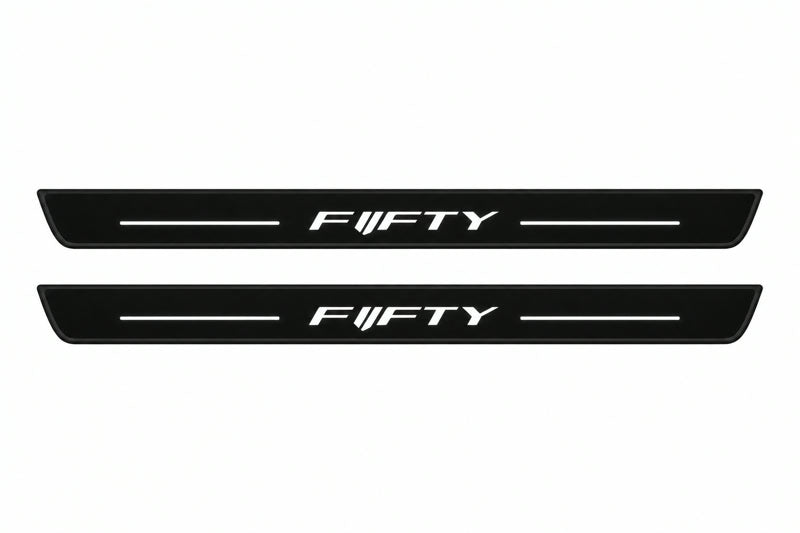 Catalog illustration of two front black Matte PRO LED door sill plates with illuminated Fifty lettering for Chevrolet Camaro VI.
