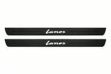 Catalogue illustration of two front black Matte PRO LED door sill plates with illuminated Lanos lettering for Chevrolet Lanos; dimensions are selected during manufacture.