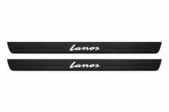 Catalogue illustration of two front black Matte PRO LED door sill plates with illuminated Lanos lettering for Chevrolet Lanos; dimensions are selected during manufacture.