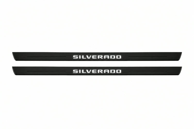 Catalogue illustration of two front black Matte PRO LED door sill plates with illuminated Silverado lettering for Chevrolet Silverado K2XX; dimensions are selected during manufacture.