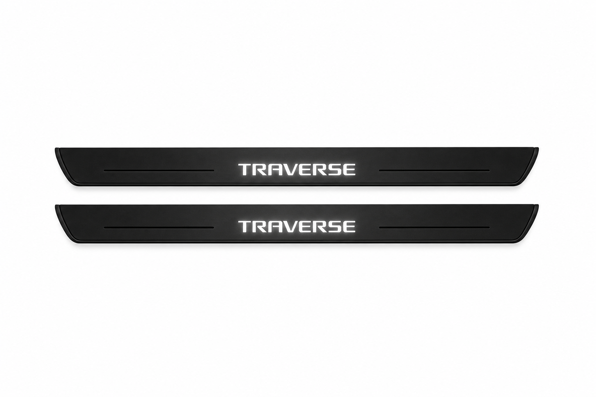 Catalogue illustration of two black Matte PRO front door sill plates with illuminated geometric TRAVERSE lettering on the upper surface. Thin decorative lines and edges are unlit; rear plates for FRONT+REAR are not pictured. Dimensions are selected for the Chevrolet Traverse C1XX during manufacture.