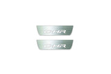Two short silver-finished door sill plates with C-HR lettering on a light background, straight-on view.