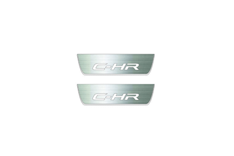 Two short silver-finished door sill plates with C-HR lettering on a light background, straight-on view.