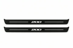 Catalogue illustration of two front black Matte PRO LED door sill plates with illuminated 200 lettering for Chrysler 200 II; dimensions are selected during manufacture.