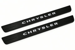 Catalogue illustration of two front black Matte PRO LED door sill plates with illuminated Chrysler lettering for Chrysler 200 II; dimensions are selected during manufacture.