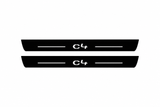 Catalogue illustration of two black Matte PRO front sill plates with illuminated C4 lettering and straight top lines. Rear plates are not pictured; dimensions are selected for Citroën C4 B7 during manufacture.