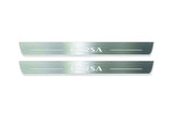 Two long silver-finished door sill plates with Corsa lettering on a light background, straight-on view.