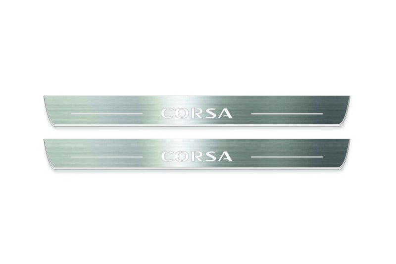 Two long silver-finished door sill plates with Corsa lettering on a light background, straight-on view.