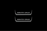 Hyundai Santa Cruz NX4 2021+ illuminated entry guards in stainless steel with Santa Cruz logo