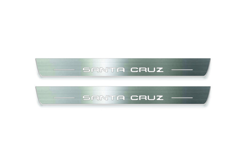 Hyundai Santa Cruz NX4 2021+ door sill plates in stainless steel with Santa Cruz logo