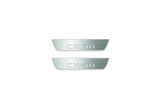 Two short silver-finished door sill plates with CX-30 lettering on a light background, straight-on view.