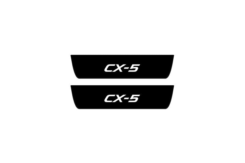Mazda CX-5 II 2017+ entry guards in matte black coated stainless steel with CX-5 logo