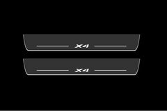 Catalog illustration of two long dark gray door sill plates with white X4 lettering and horizontal lines on a black background.