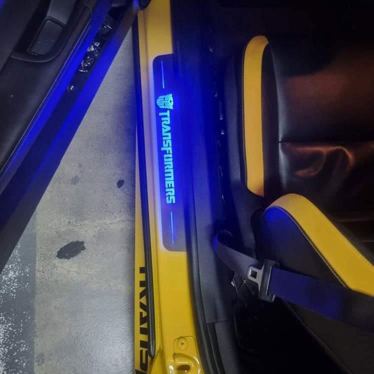 Chevrolet Camaro V E37 2009+ stainless steel LED door sill plates with Transformers logo
