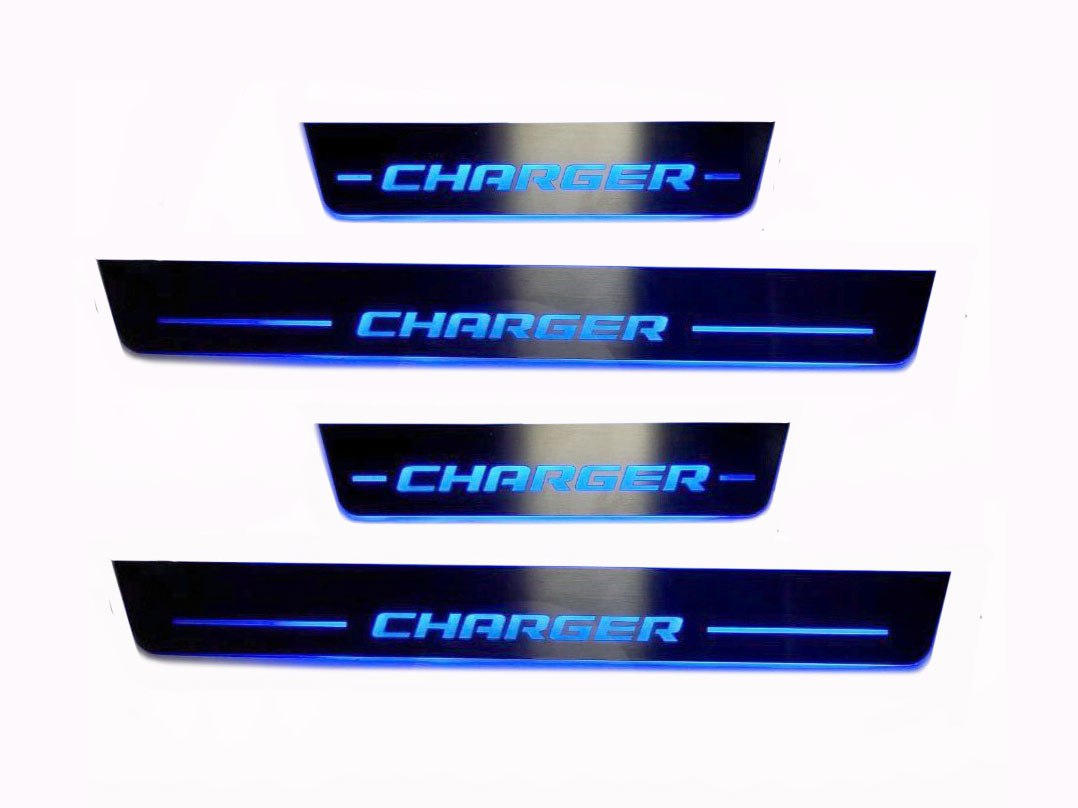 Four door sill plates with Charger lettering and illuminated blue edges.