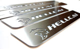 Close-up of Hellcat lettering and head emblems on silver-finished door sill plates.
