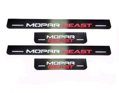 Four reflective door sill plates with white Mopar and red Beast lettering.