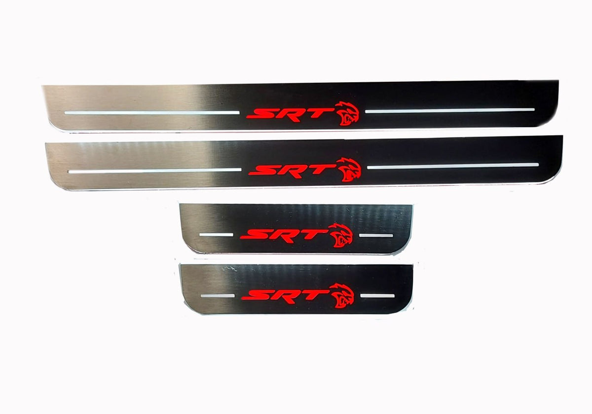 Four reflective door sill plates with red SRT lettering and Hellcat-head emblems, straight-on view.