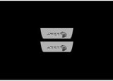 Catalog illustration of two short gray door sill plates with SRT lettering and Hellcat-head emblems on a black background.