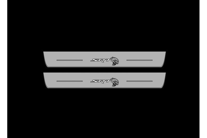 Catalog illustration of two long gray door sill plates with SRT lettering and Hellcat-head emblems on a black background.