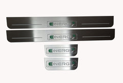 Four reflective door sill plates with rectangular Energi emblems, green plug and arrow details.