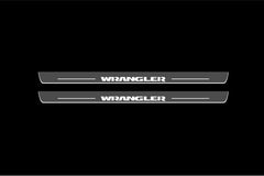 Catalog illustration of two long gray door sill plates with Wrangler lettering on a black background.